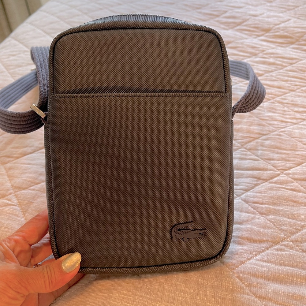 Slightly used Lacoste small body bag for mens